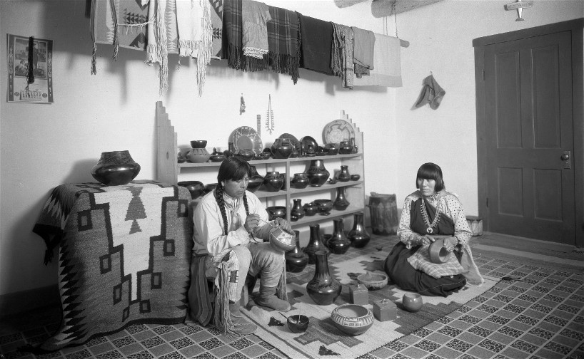 Juan Cruz and Tonita Roybal working on their pottery. Photo by T. Harmon Parkhurst, Courtesy Palace of the Governors Photo Archives (NMHM/DCA), 004032.