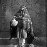 Susana Aguilar with her pottery. The bowls by her feet are a distinctive early style of white-on-red ware. Photo by T. Harmon Parkhurst, Courtesy Palace of the Governors Photo Archives (NMHM/DCA), 043608.