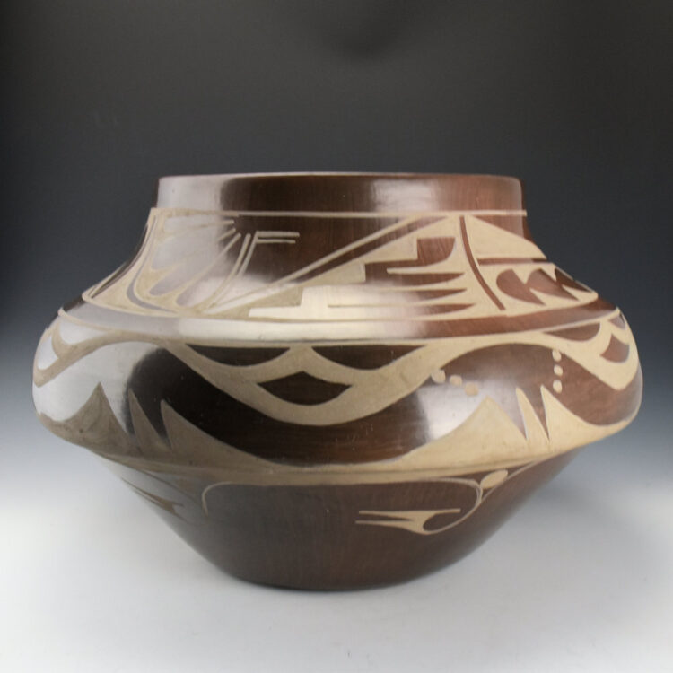 Dunlap, Carmelita - 17" Wide Brown Fired Jar with Avanyu and Feathers (1983) - Image 3