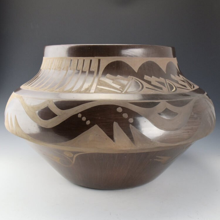 Dunlap, Carmelita - 17" Wide Brown Fired Jar with Avanyu and Feathers (1983) - Image 4