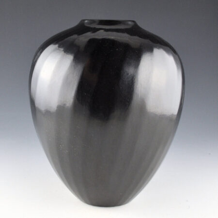Gutierrez, Denny - 8.5" Tall 32 Faceted Swirling Ribs Melon Jar (1992)
