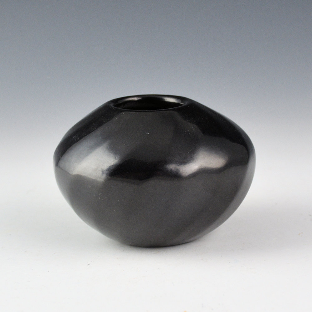 Gutierrez, Denny - Bowl with 16 Faceted Swirling Ribs (1994)